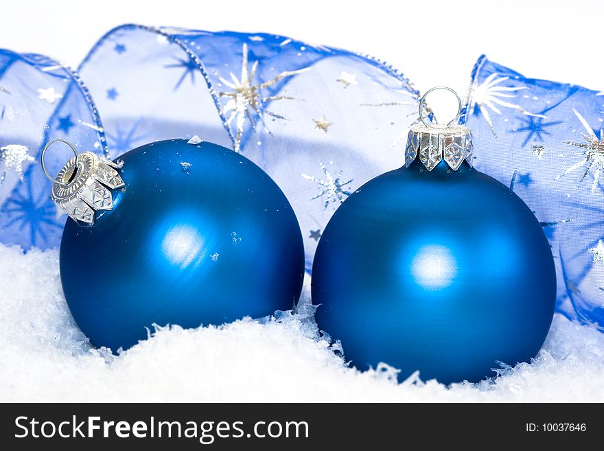 Blue Christmas balls on snow background