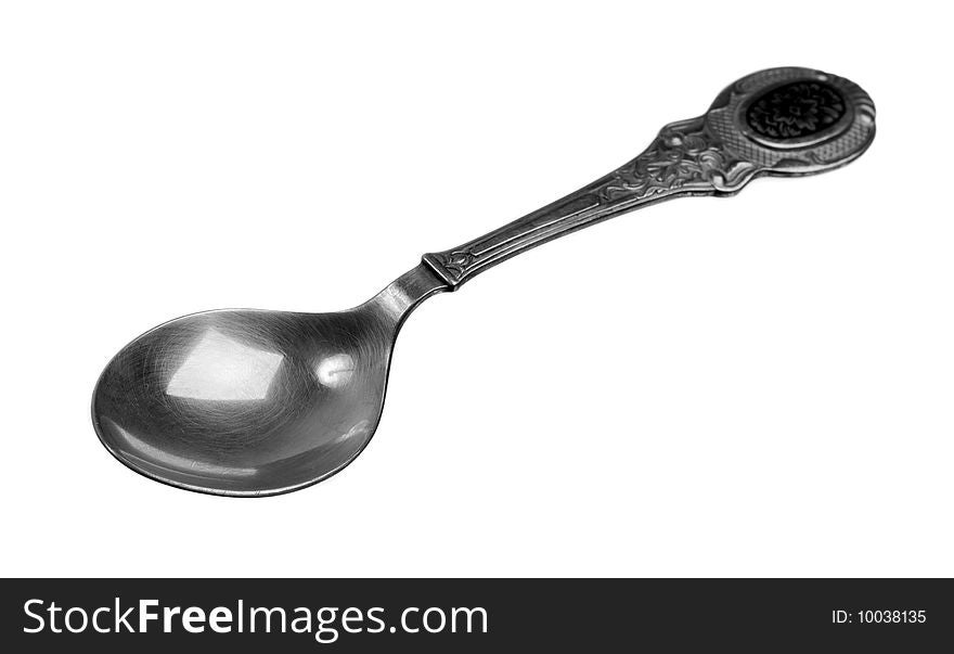 Single teaspoon over the white background