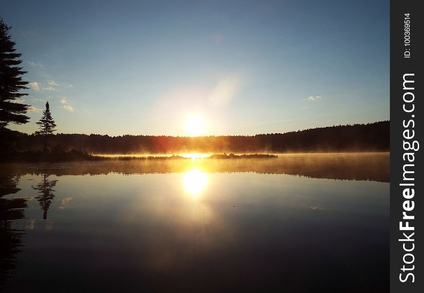 Morning sun reflected off Pog Lake. Morning sun reflected off Pog Lake