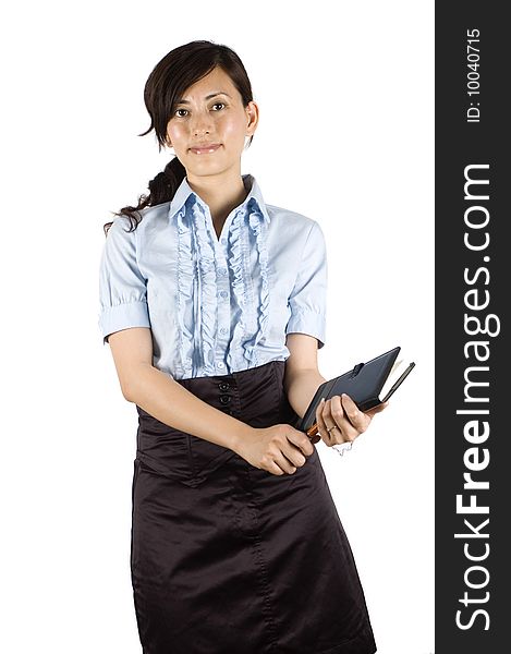 Chinese office lady, elegant clerk. Young Asian girl with kind face expression. Holding pen and notebook, reading and making notes. Chinese office lady, elegant clerk. Young Asian girl with kind face expression. Holding pen and notebook, reading and making notes.