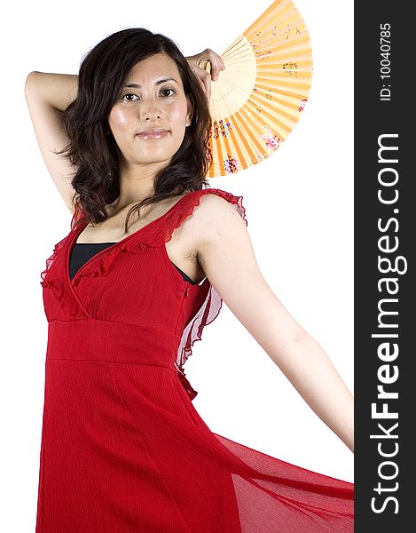 Pretty Chinese girl, female Asian model wearing red skirt, elegant night dress. Holding small fan in her hand. Pretty Chinese girl, female Asian model wearing red skirt, elegant night dress. Holding small fan in her hand.