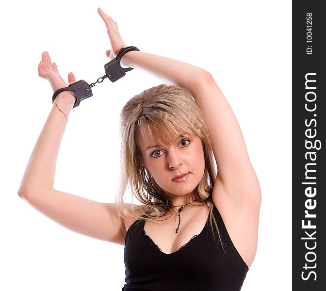 Young woman in handcuffs. Studio shoot on white background. Young woman in handcuffs. Studio shoot on white background