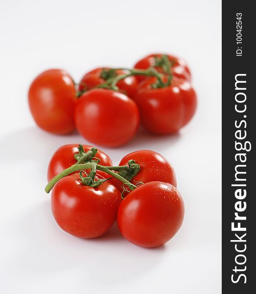 Fresh red tomatoes on white background