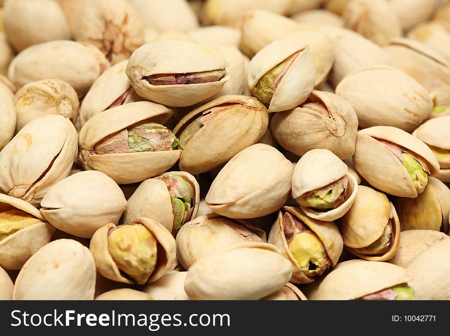 A macro shot of dry roasted pistachios.