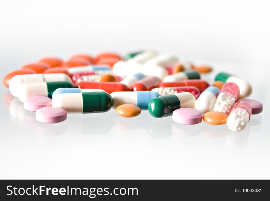 Group of pills on white background