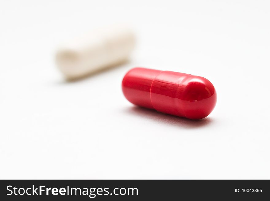 Two pills isolated on white background. Two pills isolated on white background