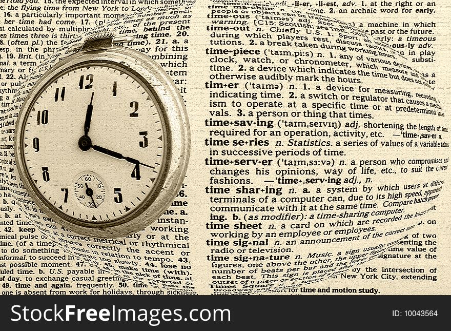 Vintage antique pocket watch on dictionary background related to various aspects of time