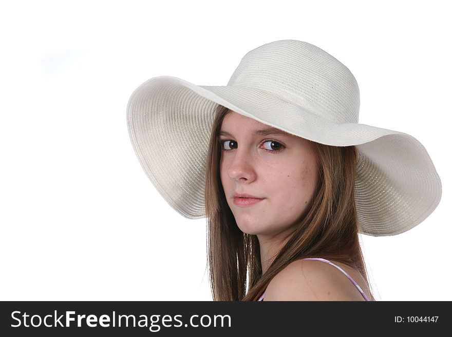 Pretty teen with long hair wearing straw hat