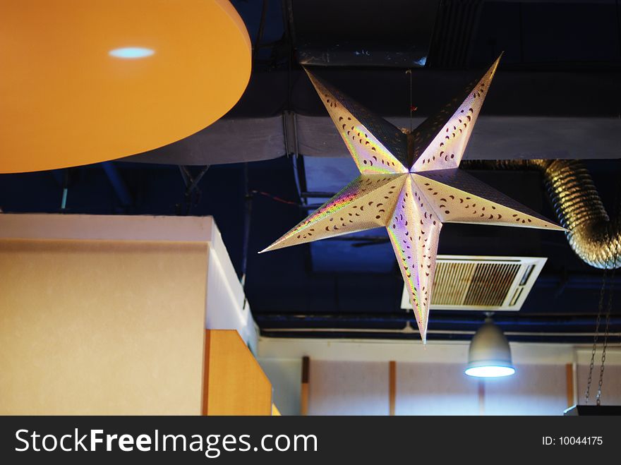 Is hanging at the sushi shop smallpox's giant five pointed star.