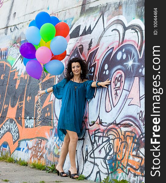 Happy woman with colorful balloons