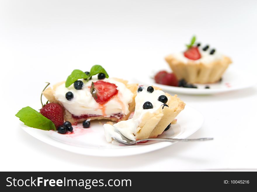 Delicious tarts with berries and mascarpone cream decorated with blackberry. Delicious tarts with berries and mascarpone cream decorated with blackberry