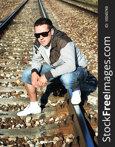 Attractive young guy on rails