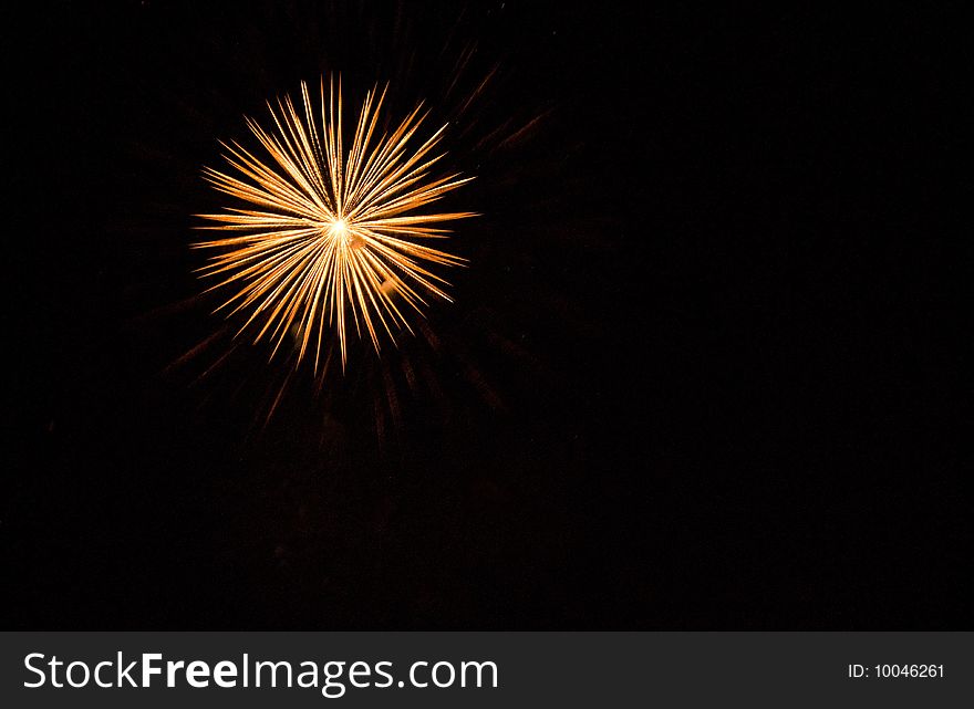 Firework against a night black sky background. Firework against a night black sky background