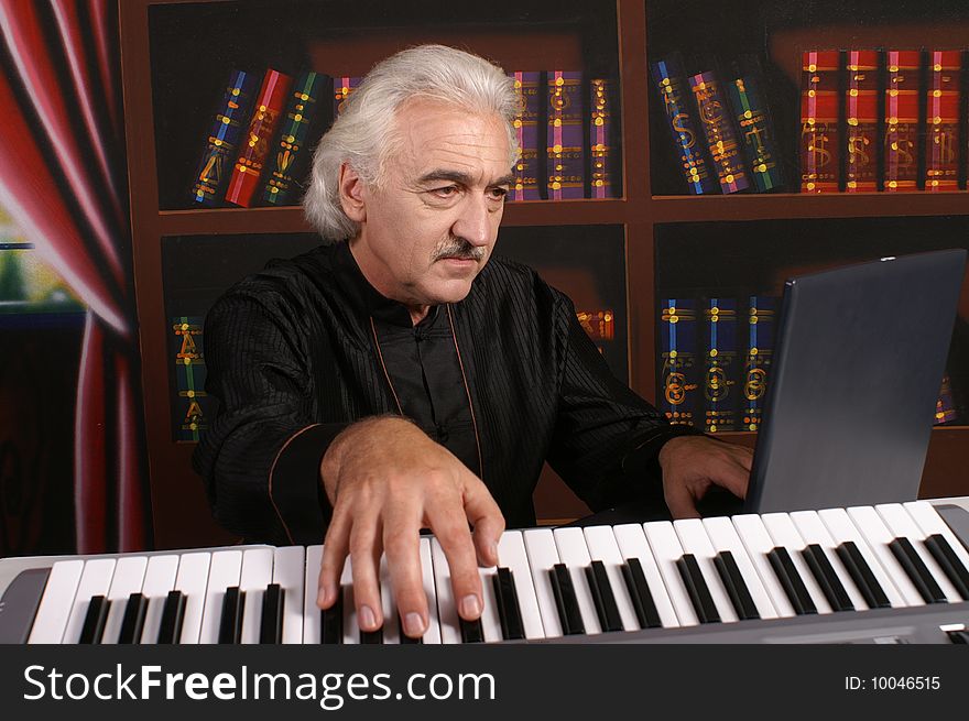Pianist man in black with piano. Pianist man in black with piano