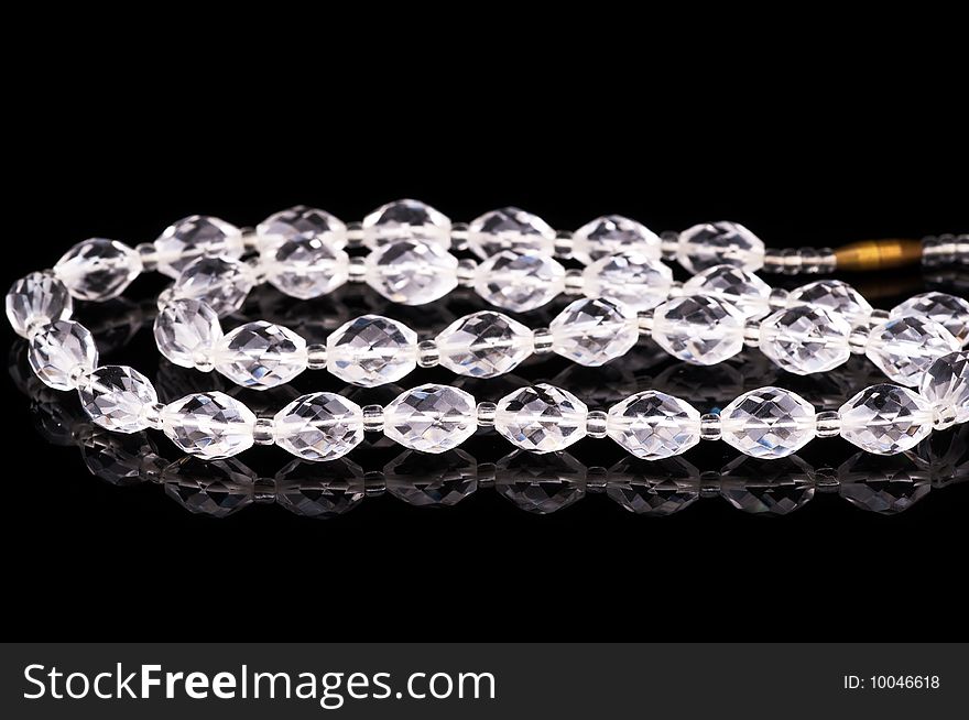 Crystal necklace on black in studio