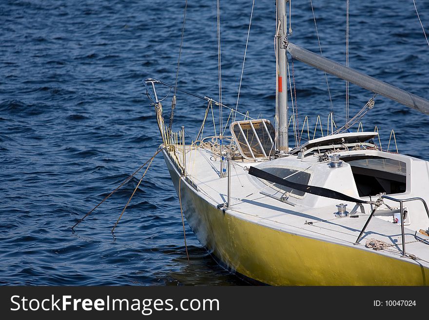 Yellow Yacht on a background sea