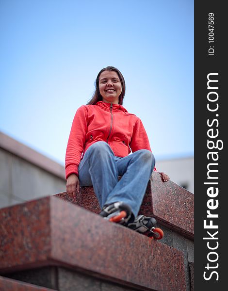 Portrait of rollerskating girl on granite stairs - shallow DOF