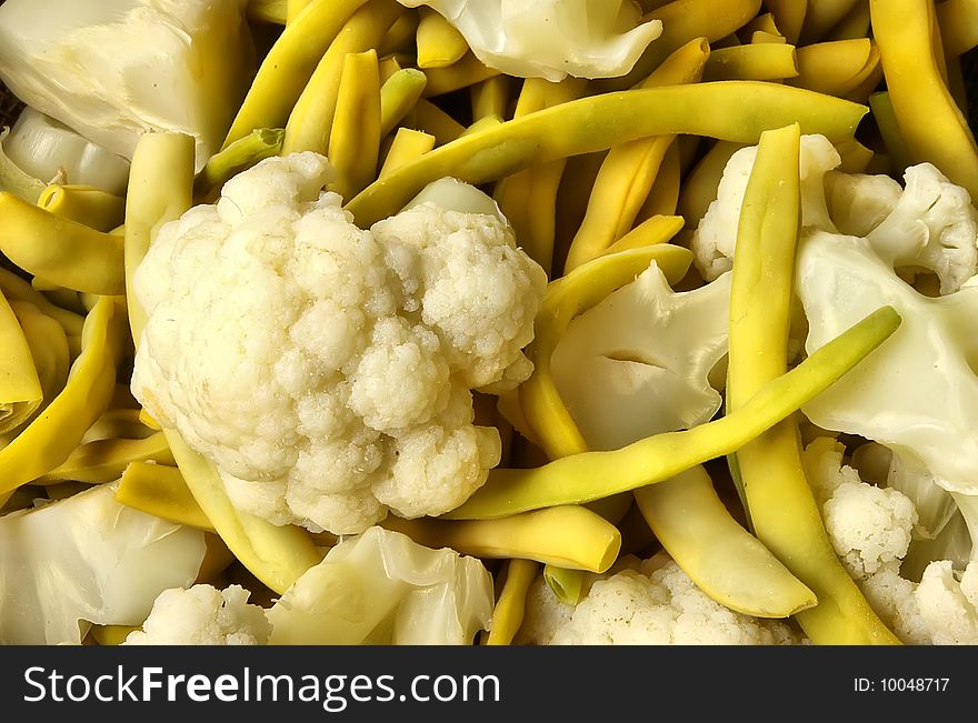 Boiled cauliflower and yellow string bean background. Boiled cauliflower and yellow string bean background