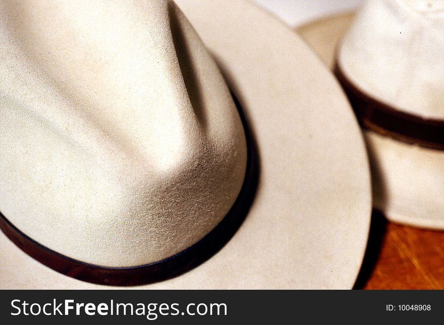 This photograph shows two hats ready to be picked up and worn. This photograph shows two hats ready to be picked up and worn.