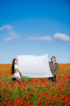 Lovely Couple In The Poppy Field Stock Photos Lovely Couple In The Poppy Field Stock Photos