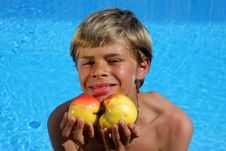 Smiling Boy Presenting Apples At Swimming Pool Royalty Free Stock Photography Smiling Boy Presenting Apples At Swimming Pool Royalty Free Stock Photography