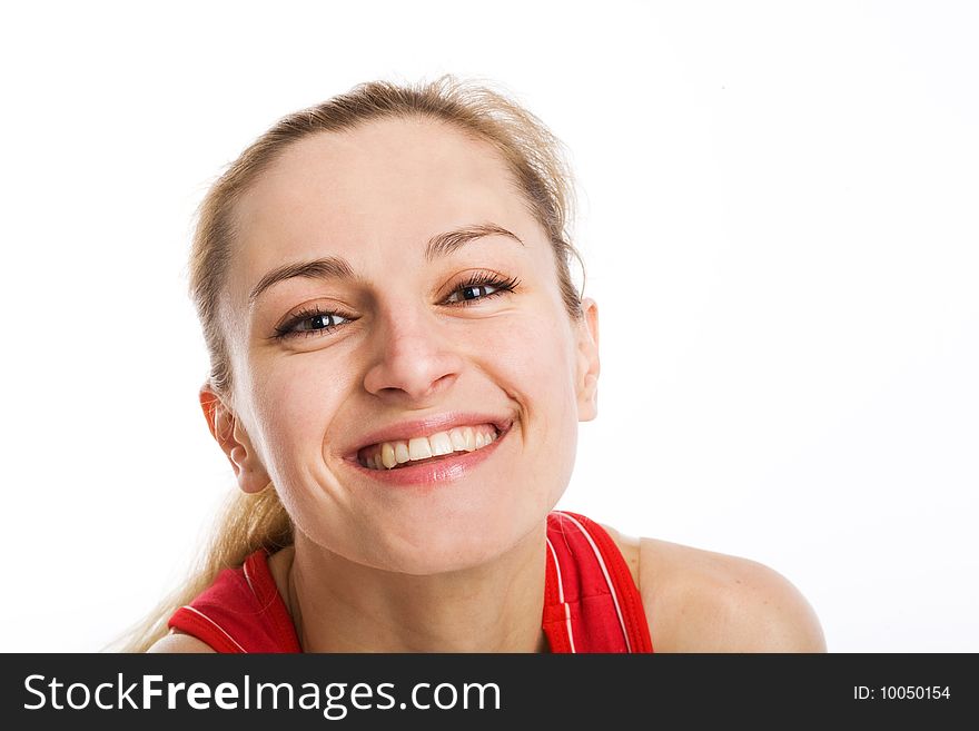 A smiling sporty blonde in red leotard posing on a white background. A smiling sporty blonde in red leotard posing on a white background