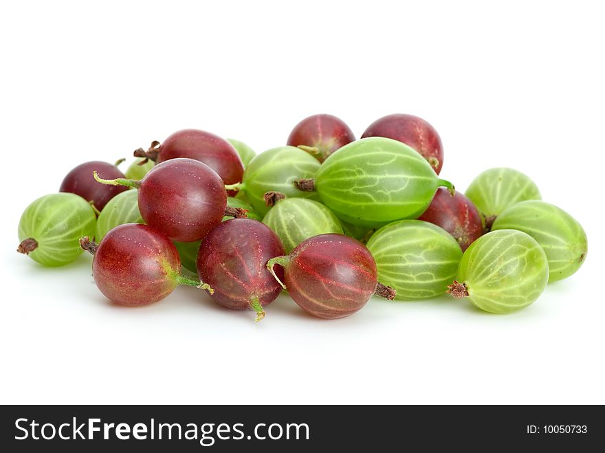 Pile of red and green gooseberries isolated on the white background