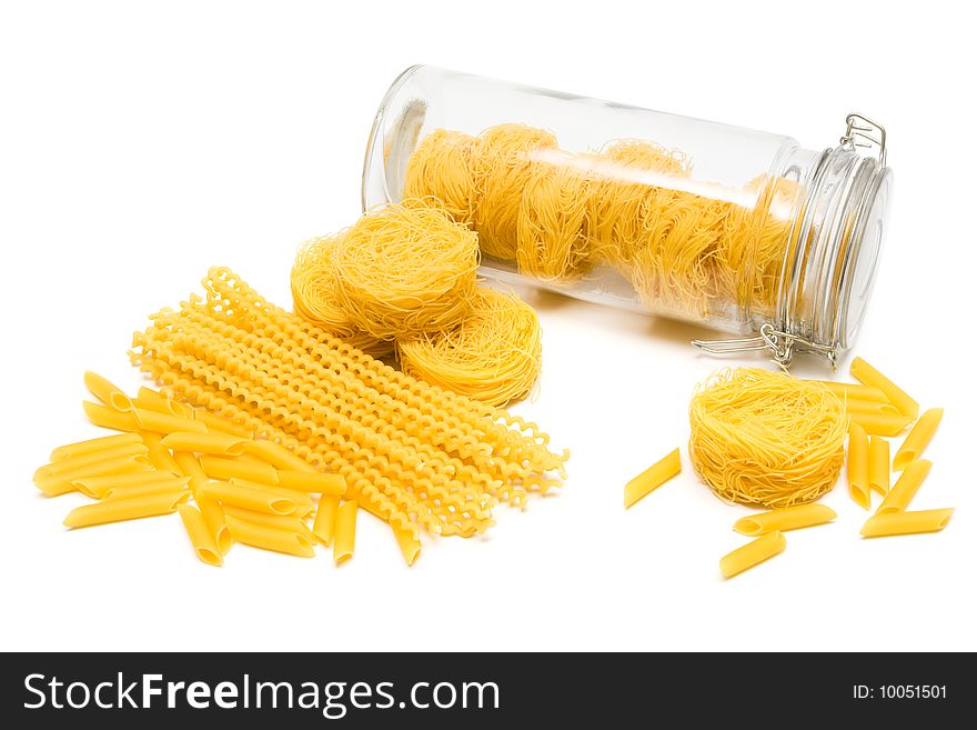 Pasta in glass jar on a white background