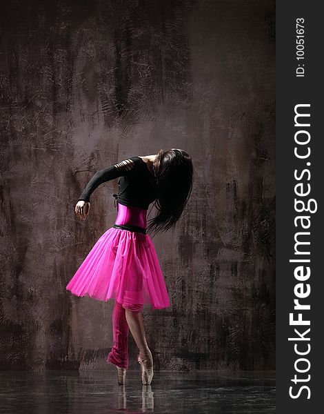 Modern style dancer jumping on dirty grunge background. Modern style dancer jumping on dirty grunge background