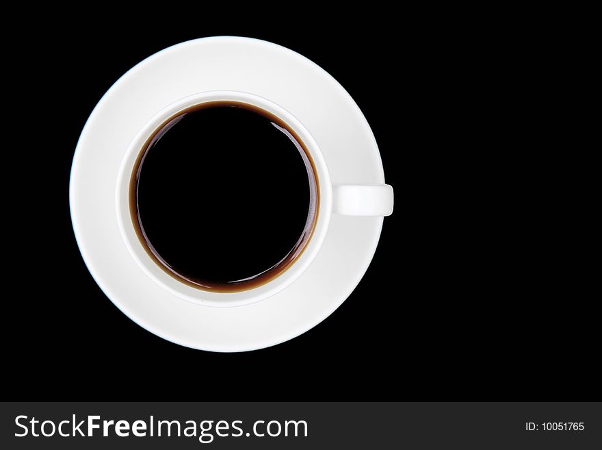 Coffee cup and saucer on a black background