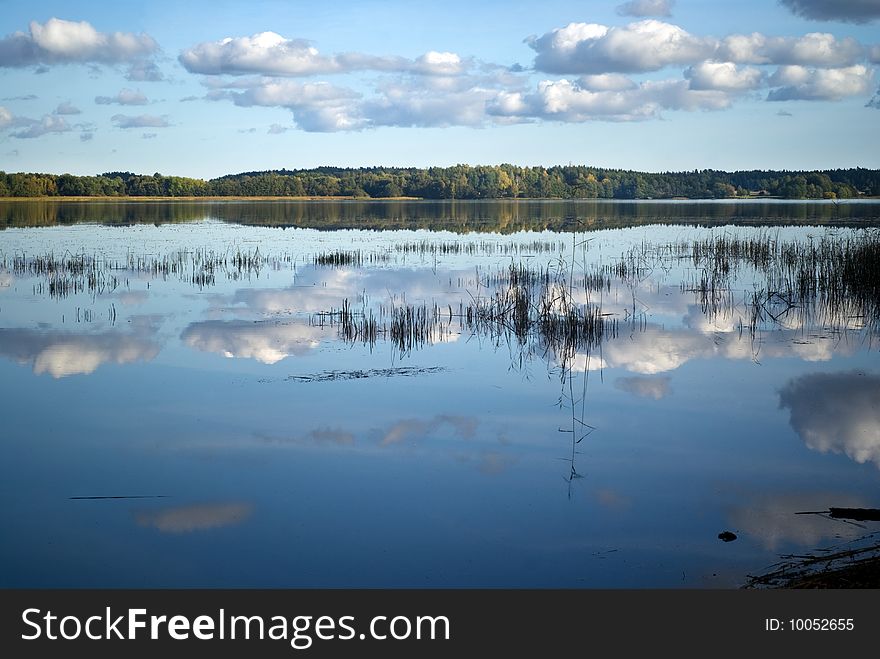 White clouds reflected in a lake