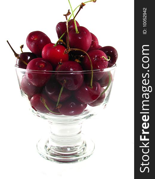 A bowl of fresh cherries on a white background. A bowl of fresh cherries on a white background