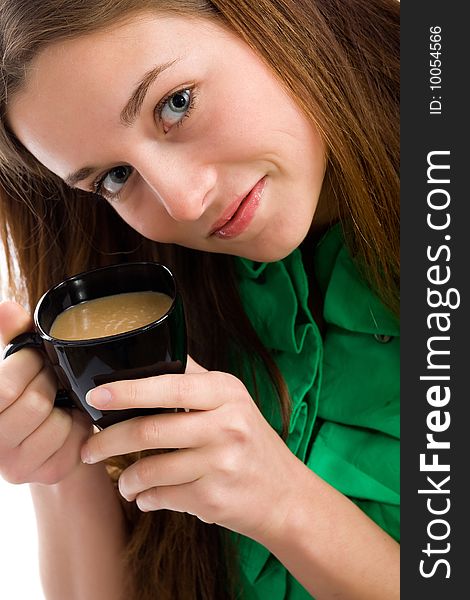 An attractive young woman with a coffee cup in her hands. An attractive young woman with a coffee cup in her hands