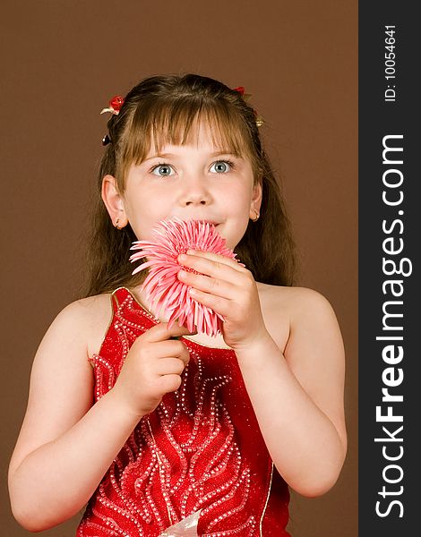 An image of a beautiful girl with pink flower. An image of a beautiful girl with pink flower