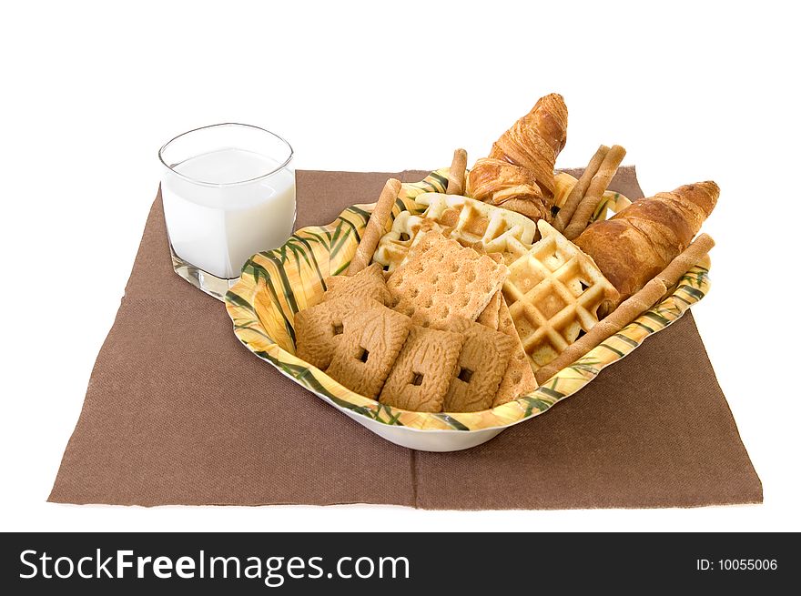 Variety of sweets with milk on white background. Variety of sweets with milk on white background