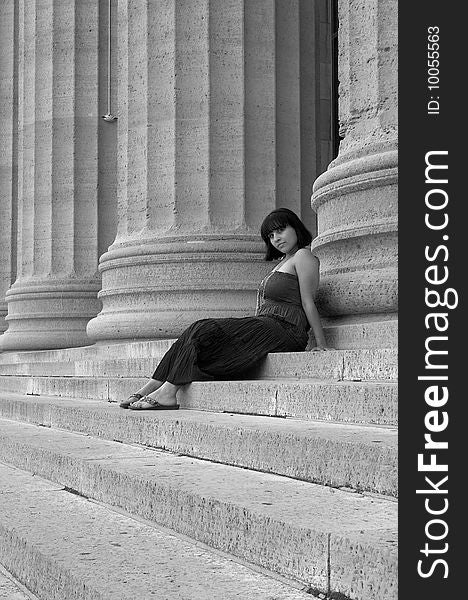 Monochrome photograph of a young Hispanic woman sitting on the steps of the Philadelphia art museum. Monochrome photograph of a young Hispanic woman sitting on the steps of the Philadelphia art museum.