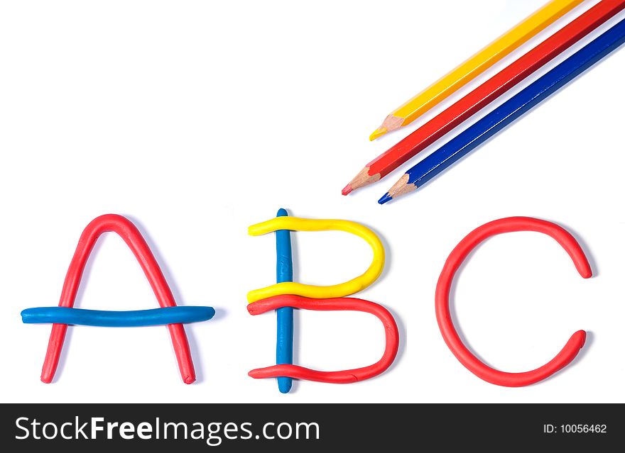 The characters a, b and c shaped in primary coloured plasticine and three coloured pencils, isolated on white. The characters a, b and c shaped in primary coloured plasticine and three coloured pencils, isolated on white.
