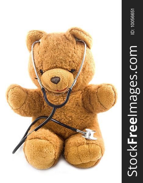 Brown teddybear acting as a doctor with a stetoscope isolated on white