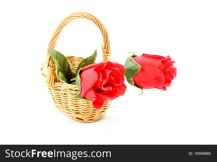 Isolated basket of red roses on white