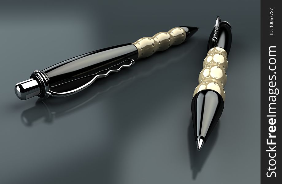 2 executive pens lying head to toe on a partially reflective surface. 2 executive pens lying head to toe on a partially reflective surface