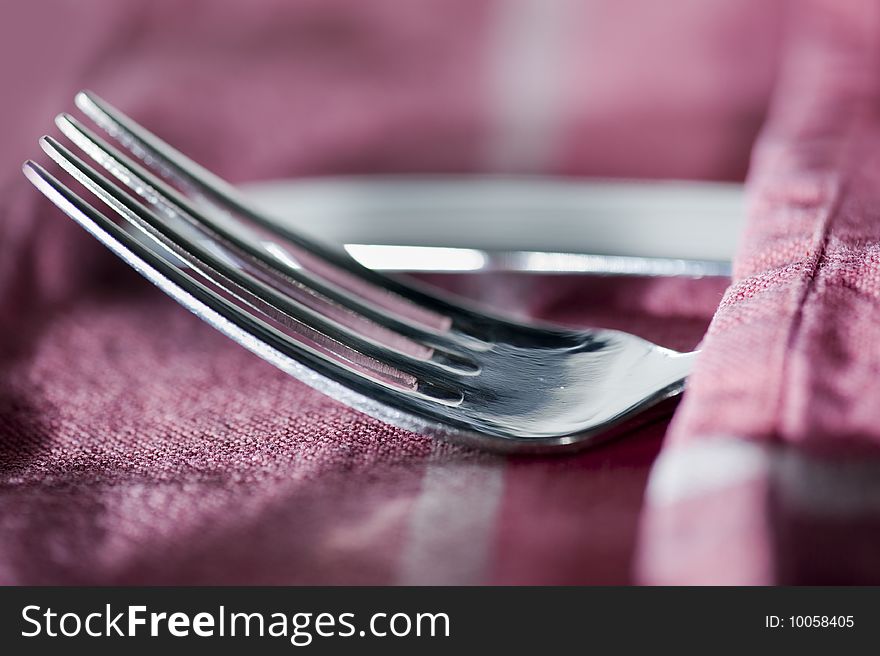 Knife and fork on a tea towel