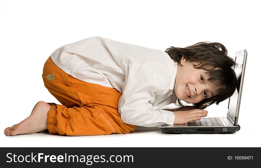 The merry boy with laptop on white background