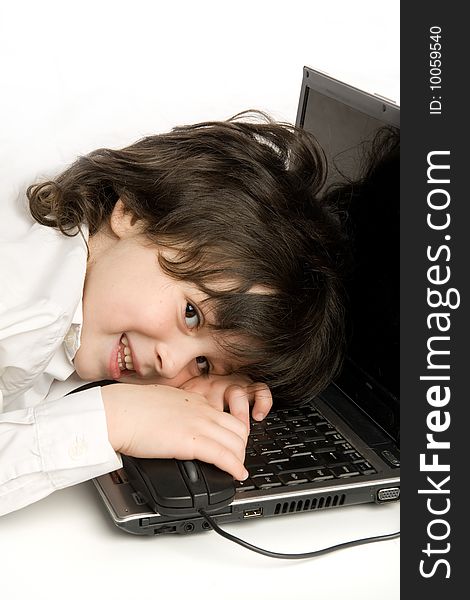 The merry boy with laptop on white background