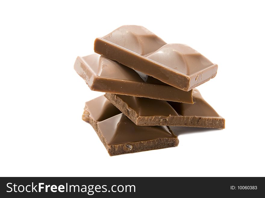 Chocolate pieces isolated on white background