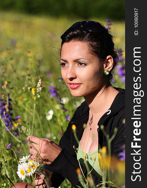 Young girl in a field with flowers