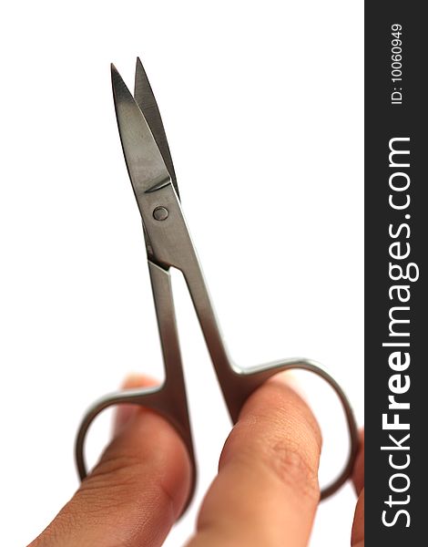 Scissors in human hand isolated on white