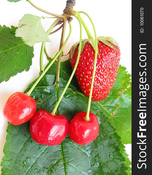 Photo of fresh strawberry and cherries isolated on white background. Photo of fresh strawberry and cherries isolated on white background