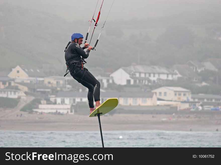 Kitesurfer surfing on hydrofoil board