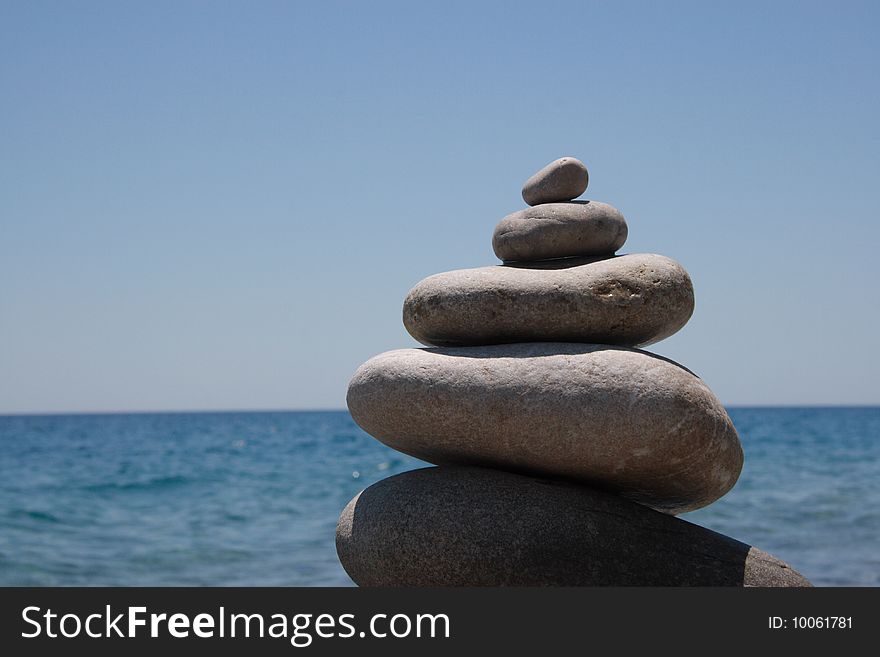 Stones on the seashore, sea blue