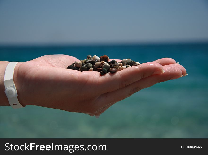 Handful of stones in hand